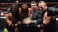 Triple H is carried away after the match against Rock